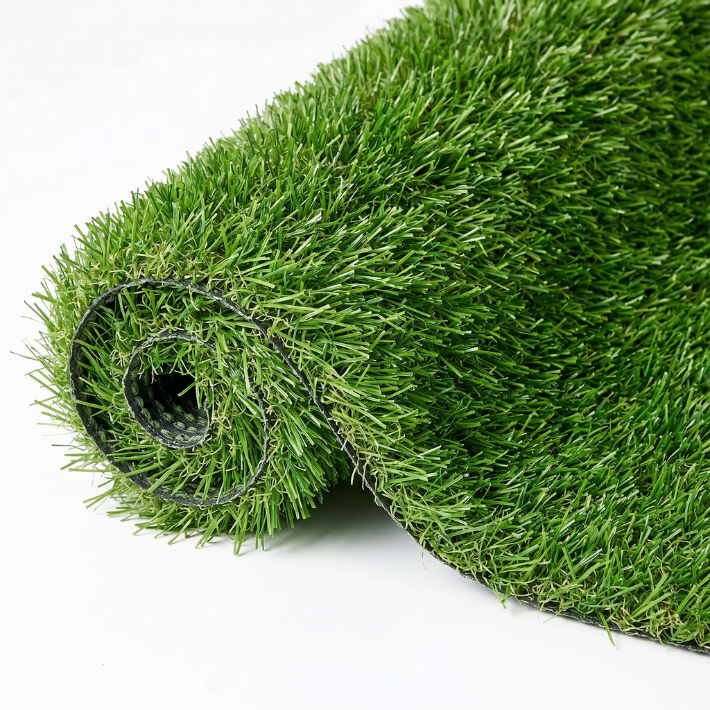 Green artificial grass carpet with rain drainage holes