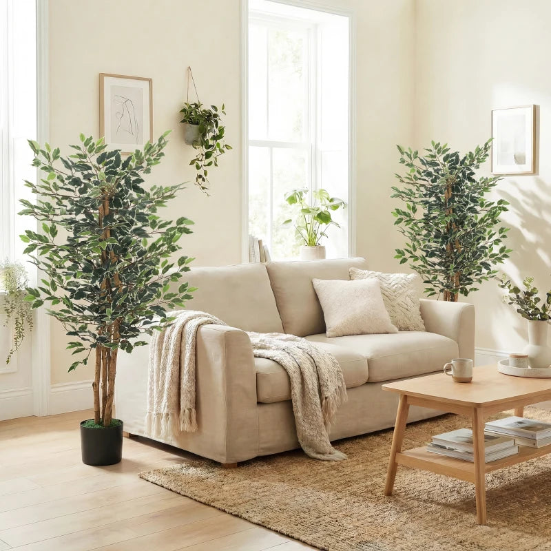 Artificial ficus tree with lush green leaves in nursery pot for indoor decoration